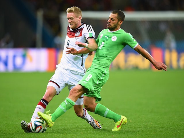 Medhi Lacen of Algeria challenges Andre Schuerrle of Germany during the 2014 FIFA World Cup on June 30, 2014