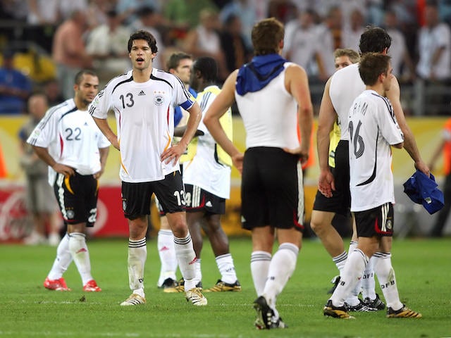 German midfielder Michael Ballack (2ndL) looks dejected at the end of the World Cup 2006 semi final football game Germany vs. Italy, 04 July 2006