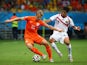 Dirk Kuyt of the Netherlands is challenged by Christian Bolanos of Costa Rica during the 2014 FIFA World Cup Brazil Quarter Final match between the Netherlands and Costa Rica at Arena Fonte Nova on July 5, 2014 