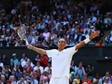 Nick Kyrgios of Australia celebrates during his Gentlemen's Singles fourth round match against Rafael Nadal of Spain on day eight of the Wimbledon Lawn Tennis Championships at the All England Lawn Tennis and Croquet Club on July 1, 2014