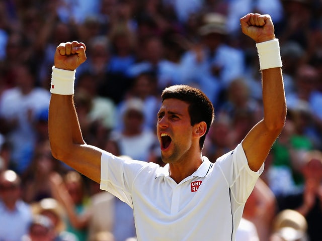 Novak Djokovic of Serbia celebrates after winning his Gentlemen's Singles semi-final match against Grigor Dimitrov of Bulgaria on day eleven of the Wimbledon Lawn Tennis Championships at the All England Lawn Tennis and Croquet Club on July 4, 2014
