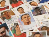 Panini World Cup stickers are displayed, including one of England star Wayne Rooney (C), on May 28, 2014 