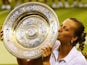 Czech tennis player Petra Kvitova lifts the Venus Rosewater Dish after winning Wimbledon on July 5, 2014