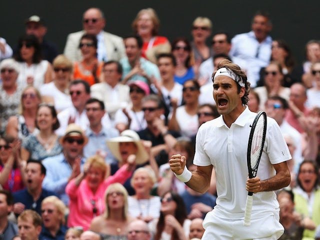 Roger Federer of Switzerland celebrates during the Wimbledon Gentlemen's Singles Final match against Novak Djokovic of Serbia on July 6, 2014