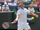 Switzerland's Roger Federer returns against Spain's Tommy Robredo during their men's singles fourth round match on day eight of the 2014 Wimbledon Championships at The All England Tennis Club in Wimbledon, southwest London, on July 1, 2014
