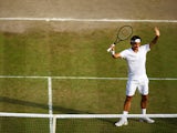 Roger Federer of Switzerland celebrates after winning his Gentlemen's Singles semi-final match against Milos Raonic of Canada on day eleven of the Wimbledon Lawn Tennis Championships at the All England Lawn Tennis and Croquet Club on July 4, 2014