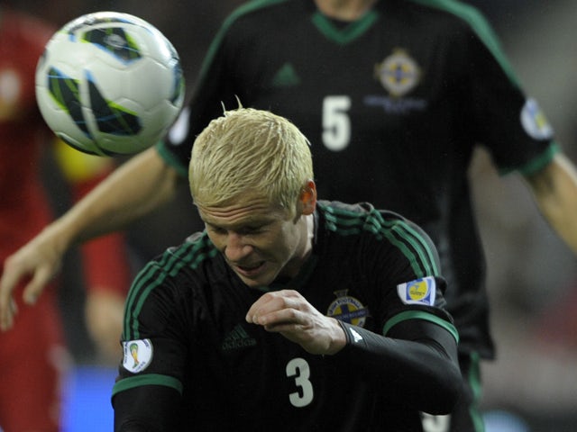Northern Ireland's defender Ryan McGivern heads the ball during the WC2014 qualifying football match Portugal vs Northern Ireland at the Dragao Stadium in Porto, on October 16, 2012