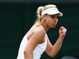 Sabine Lisicki of Germany celebrates during her Ladies' Singles fourth round match against Yaroslava Shvedova of Kazakhstan on day eight of the Wimbledon Lawn Tennis Championships at the All England Lawn Tennis and Croquet Club on July 1, 2014