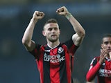 Simon Francis of Bournemouth celebrates their victory to the fans at the final whistle during the Sky Bet Championship match between Blackburn Rovers and Bournemouth at Ewood Park on March 12, 2014