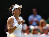Simona Halep of Romania celebrates after winning her Ladies' Singles fourth round match against Zarina Diyas of Kazakhstan on day eight of the Wimbledon Lawn Tennis Championships at the All England Lawn Tennis and Croquet Club on July 1, 2014