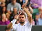 Stan Wawrinka of Switzerland celebrates after winning his Gentlemen's Singles third round match against Denis Istomin of Uzbekistan on day seven of the Wimbledon Lawn Tennis Championships at the All England Lawn Tennis and Croquet Club on June 30, 2014