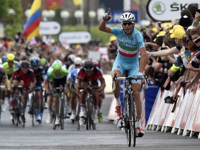 Italy's Vincenzo Nibali celebrates as he crosses the finish line at the end of the 201 km second stage of the 101th edition of the Tour de France cycling race on July 6, 2014 between York and Sheffield