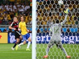 Andre Schuerrle of Germany scores his team's seventh goal past Julio Cesar of Brazil during the 2014 FIFA World Cup Brazil Semi Final match on July 8, 2014