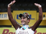 Stage winner Blel Kadri of France and AG2R La Mondiale celebrates on the podium after winning the eighth stage of the 2014 Tour de France on July 12, 2014