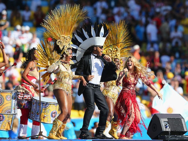 Musician Carlinhos Brown and singer Shakira perform during the closing ceremony prior to the 2014 FIFA World Cup Brazil Final match on July 13, 2014