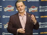 Team owner Dan Gilbert of the Cleveland Cavaliers talks to the media prior to the game against the Brooklyn Nets at Quicken Loans Arena on October 30, 2013