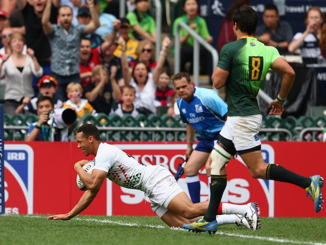 Dan Norton of England scores a try during the Cup quarter-final match between England and South Africa during the 2014 Hong Kong Sevens at Hong Kong International Stadium on March 30, 2014