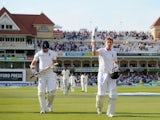 Joe Root and James Anderson of England leave the field at stumps on day three of 1st Investec Test match between England and India at Trent Bridge on July 11, 2014