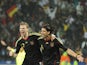 Germany's midfielder Sami Khedira (R) and Germany's defender Per Mertesacker celebrate after Khedira scored a goal during the third place World Cup 2010 football match Uruguay versus Germany on July 10, 2010