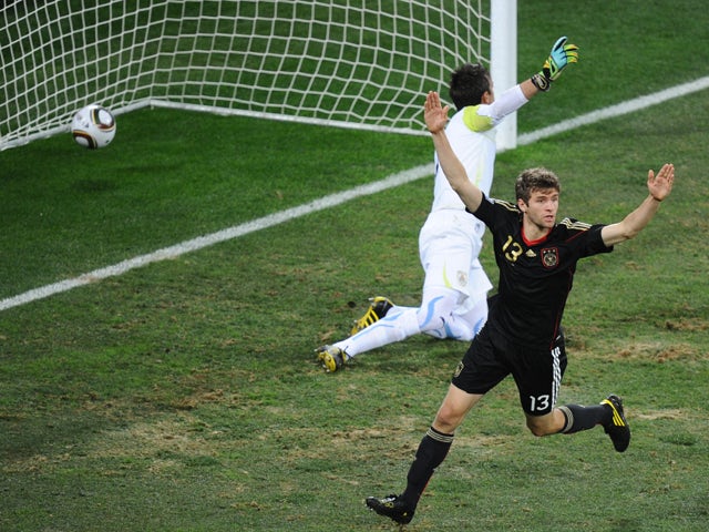 Germany's midfielder Thomas Muller scores past Uruguay's goalkeeper Fernando Muslera during the 2010 World Cup third place football match between Uruguay and Germany on July 10, 2010