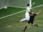 Germany's midfielder Thomas Muller scores past Uruguay's goalkeeper Fernando Muslera during the 2010 World Cup third place football match between Uruguay and Germany on July 10, 2010