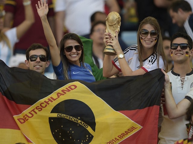 Germany's fans cheer prior to the 2014 FIFA World Cup final football match between Germany and Argentina at the Maracana Stadium in Rio de Janeiro, Brazil, on July 13, 2014