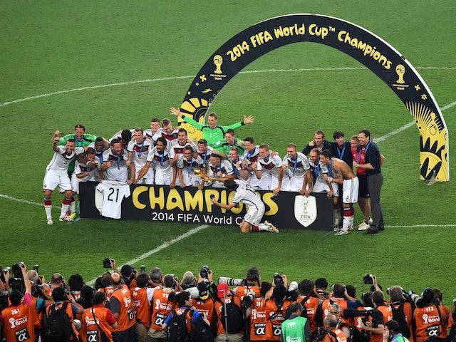 Germany's players celebrate after winning the final football match between Germany and Argentina for the FIFA World Cup at The Maracana Stadium in Rio de Janeiro on July 13, 2014