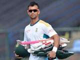 South African cricketer Jean-Paul Duminy walks to the field during a practice session at the Pallekele International Cricket Stadium in Pallekele on July 8, 2014