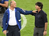 Germany's coach Joachim Loew (R) commiserates with Brazil's coach Luiz Felipe Scolari after Brazil lost the semi-final football match on July 8, 2014