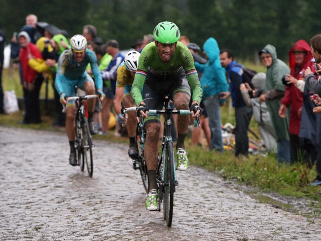 Lars Boom of The Netherlands and the Belkin Pro Cycling Team enters the final sections of cobbles en route to victory in the fifth stage of the 2014 Tour de France on July 9, 2014