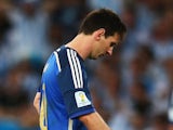Lionel Messi of Argentina (R) looks dejected after a goal during the 2014 FIFA World Cup Brazil Final match between Germany and Argentina at Maracana on July 13, 2014