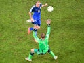 Germany's goalkeeper Manuel Neuer (FRONT) prepares to make a save from Argentina's forward Rodrigo Palacio during the final football match o