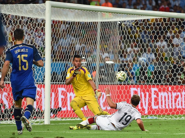 Mario Goetze of Germany scores his team's first goal past Sergio Romero of Argentina in extra time during the 2014 FIFA World Cup inal on July 13, 2014