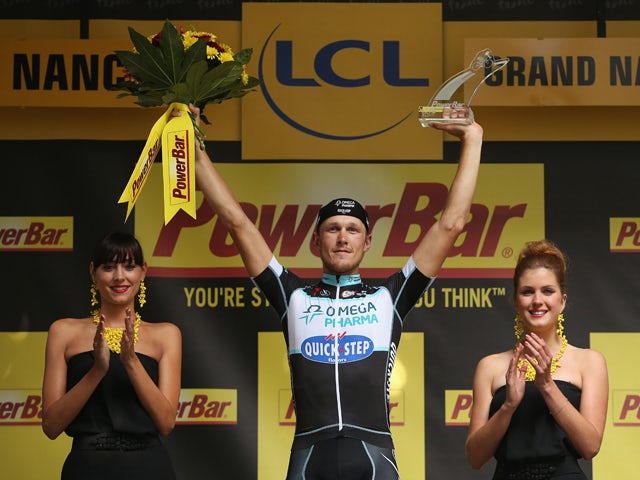 Matteo Trentin of Italy and the Omega Pharma - Quick-Step Cycling Team celebrates on the podium after winning stage seven of the 2014 Le Tour de France from Epernay to Nancy on July 11, 2014