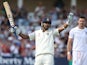 ndia's Murali Vijay celebrates after reaching his century as England bowler James Anderson (R) looks on during play on day 1 of the first cricket Test match between England and India at Trent Bridge in Nottingham, central England, on July 9, 2014