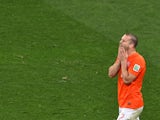 Netherlands' defender Ron Vlaar reacts after missing during penalty shoot-outs following extra time during the semi-final football match between Netherlands and Argentina of the FIFA World Cup at The Corinthians Arena in Sao Paulo on July 9, 2014