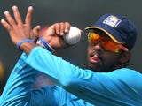 Sri Lankan bowler Sachithra Senanayake delivers a ball during a practice session at the R. Premadasa International Cricket Stadium in Colombo on July 5, 2014