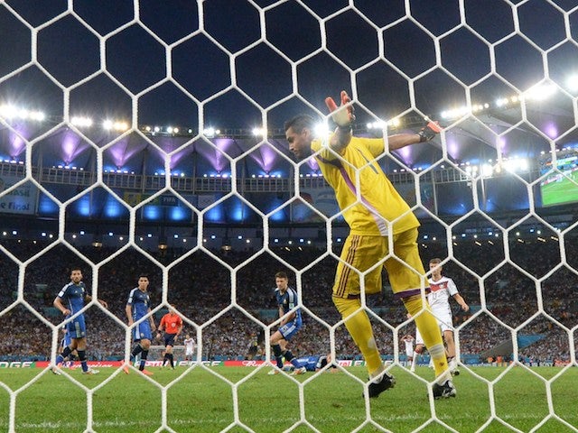 Argentina's goalkeeper Sergio Romero (C) watches a miss on goal during the 2014 FIFA World Cup final football match between Germany and Argentina on July 13, 2014