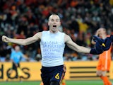 Spain's midfielder Andres Iniesta celebrates after scoring during extra-time in the 2010 World Cup football final Netherlands vs. Spain on July 11, 2010