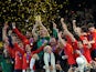 Spain's national football team players celebrate with the trophy during the award ceremony following the 2010 World Cup football final Netherlands vs. Spain on July 11, 2010