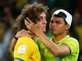 Thiago Silva of Brazil (R) consoles teammate David Luiz after Germany's 7-1 victory during the 2014 FIFA World Cup Brazil Semi Final match on July 8, 2014