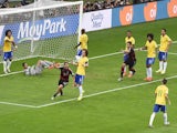 Germany's forward Thomas Mueller (3L) celebrates after scoring during the semi-final football match between Brazil and Germany at The Mineirao Stadium on July 8, 2014