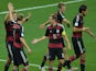 Germany's players celebrate after midfielder Toni Kroos scored his team's third goal during the semi-final football match against Brazil on July 8, 2014