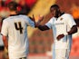 Bakary Sako of Wolverhampton Wanderers celebrates scoring his side's first goal with David Edwards of Wolverhampton Wanderers during the Pre-Season Friendly match between Cheltenham Town and Wolverhampton Wanderers at The Abbey Business Stadium on July 11