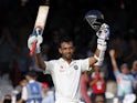 India's Ajinkya Rahane celebrates after reaching a century during play on the first day of the second cricket Test match between England and India at Lord's cricket ground in London on July 17, 2014
