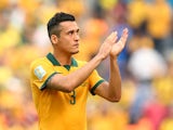 Jason Davidson of Australia acknowledges the fans after being defeated by Spain 3-0 during the 2014 FIFA World Cup Brazil Group B match between Australia and Spain at Arena da Baixada on June 23, 2014 