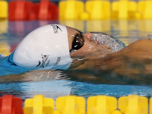 Tancock eases into 50m backstroke semis