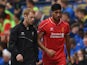 Emre Can of Liverpool is substituted with an injury during the pre season friendly match between Preston North End and Liverpool at Deepdale on July 19, 2014