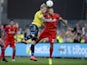 Simon Makienok of Brondby vies with Martin Skrtel of Liverpool on July 16, 2014