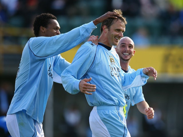 Dietemar Hamann of Manchester City celebrates with Jo Silva and Stephen Ireland after scoring the second goal during the UEFA Cup 1st Round 1st Leg Qualifying match between EB/Streymur and Manchester City at the Torsvollur Stadium on July 17, 2008